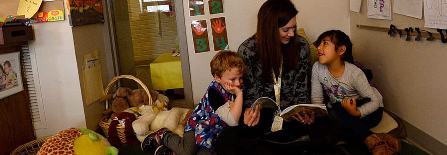 a teacher reads with her students