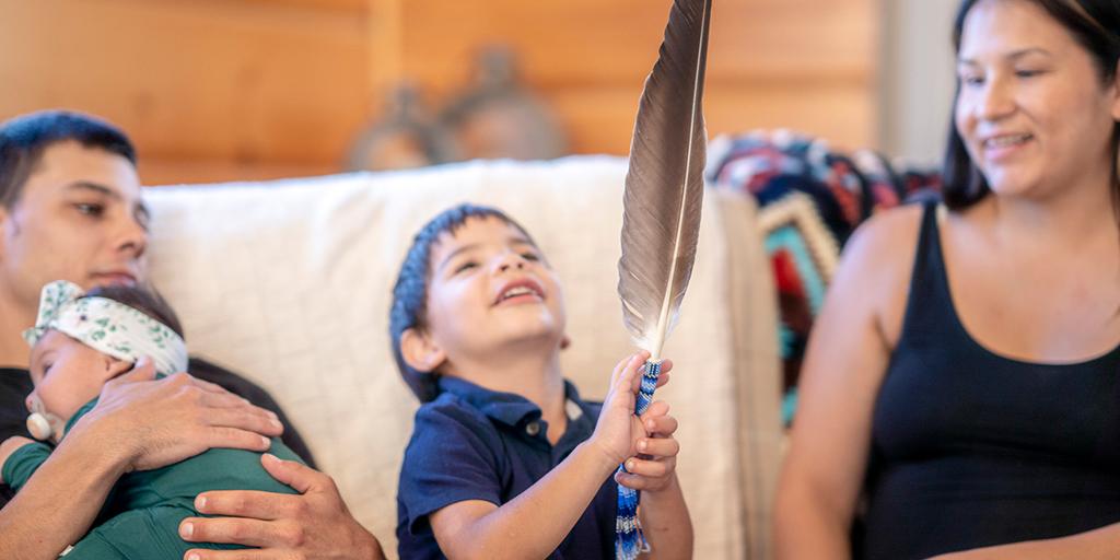 Young Indigenous family spending quality time together at home