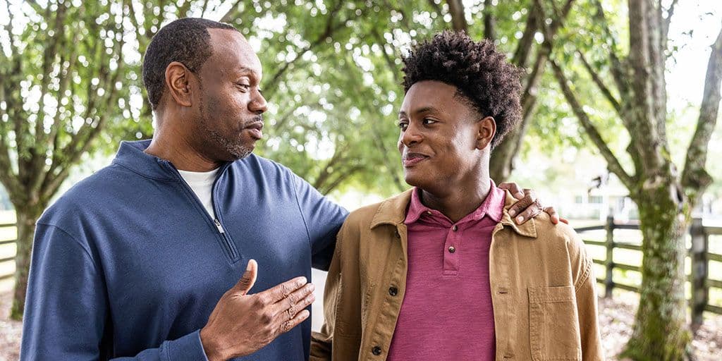 father and son go for a walk and have a conversation