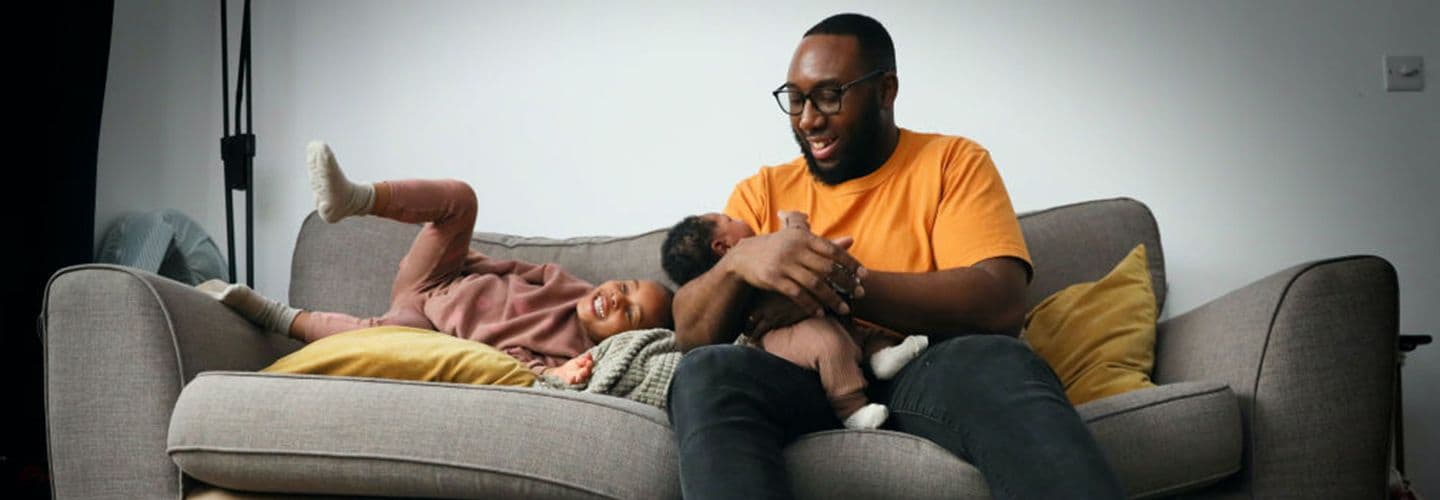 a father holds his baby